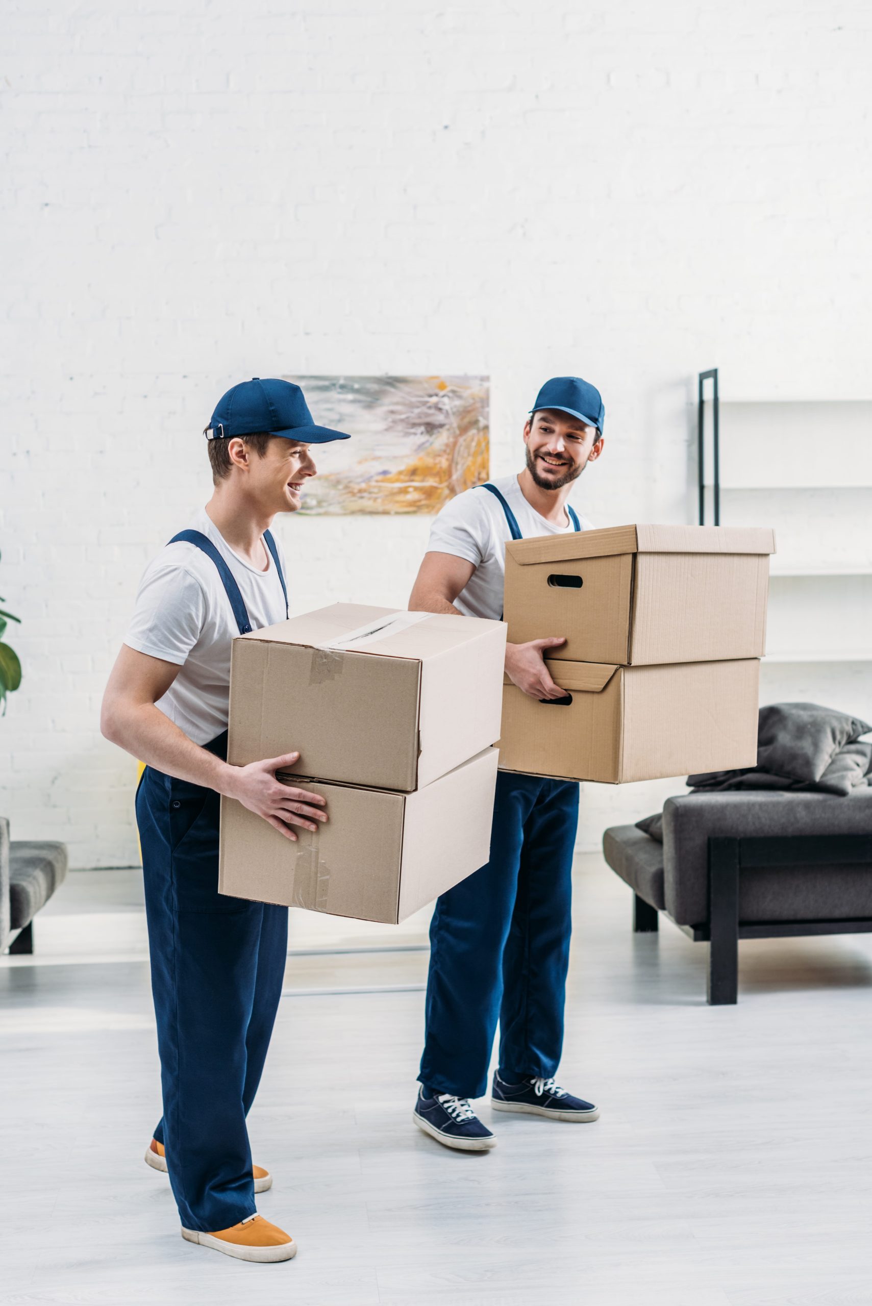 Our uniformed moving team carefully carrying boxes during a house move